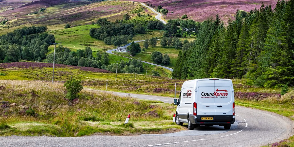 CourExpress delivery van on a winding road through the Scottish countryside